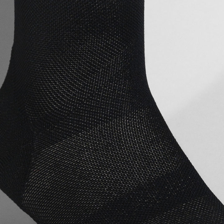 Black ultralight race day sock with targeted compression for performance.
